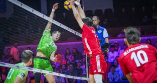 Slovenian volleyball team celebrating a point during a match