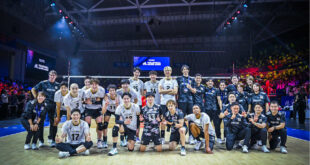 Japanese volleyball player celebrating a point during a match