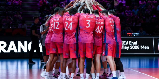 Volleyball players in action during a match