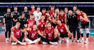German volleyball player spikes the ball during a match