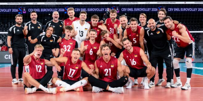 German volleyball player spikes the ball during a match