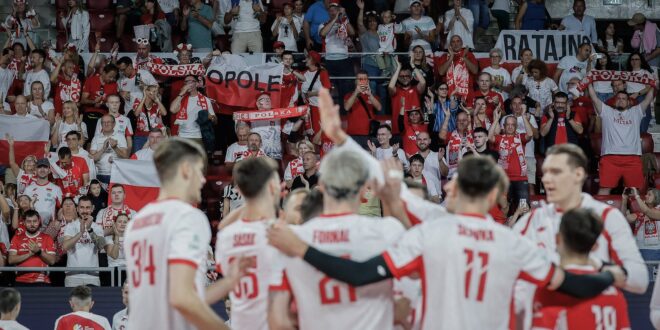 Polish volleyball team celebrating a point during a match