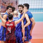Italian volleyball team celebrating a point during a match