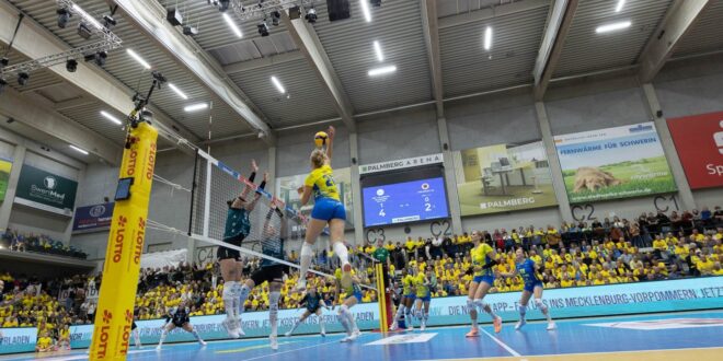 Volleyball players in action during a match between Schwerin and Dresden