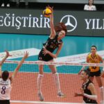 VakıfBank volleyball team celebrating a point on the court.