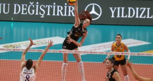 VakıfBank volleyball team celebrating a point on the court.