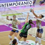 Volleyball player spiking the ball during a match