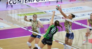 Volleyball player spiking the ball during a match
