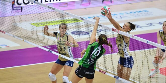 Volleyball player spiking the ball during a match